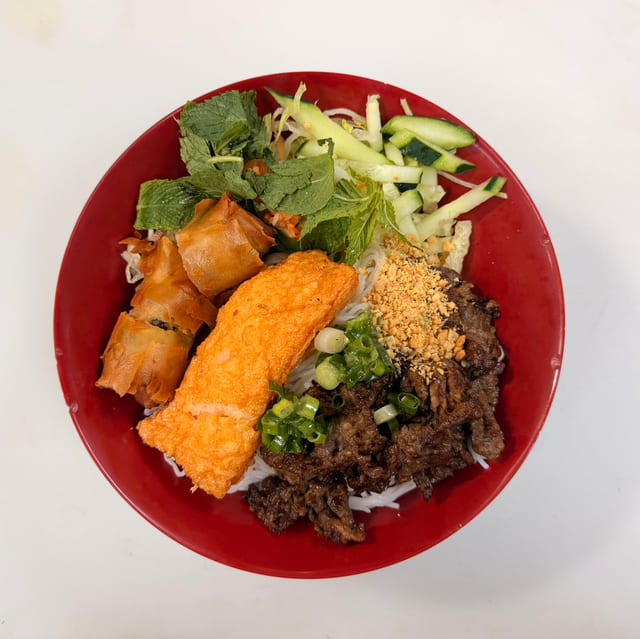 77. Grilled Beef, Shrimp Wrapped, Egg Roll on Vermicelli.