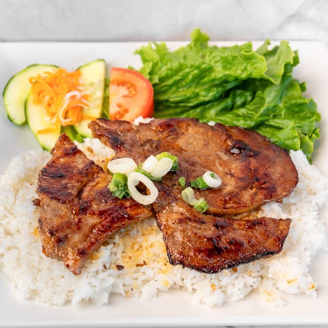 43. Grilled Pork Chop on Broken Rice Plate.