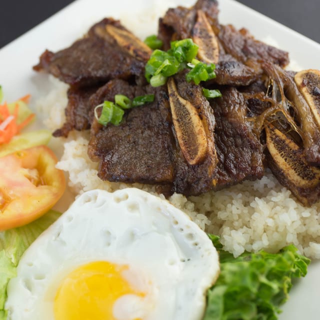 45. Korean BBQ Ribs & Fried Egg on Broken Rice Plate.